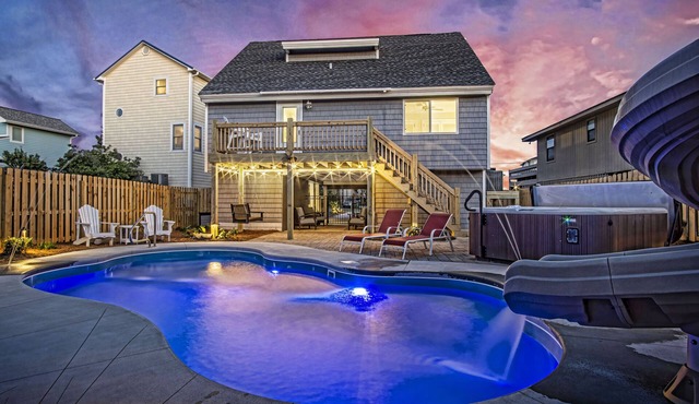 Your Ultimate Retreat – Steps from Beach with PVT Heated Pool, Slide & Hot Tub!