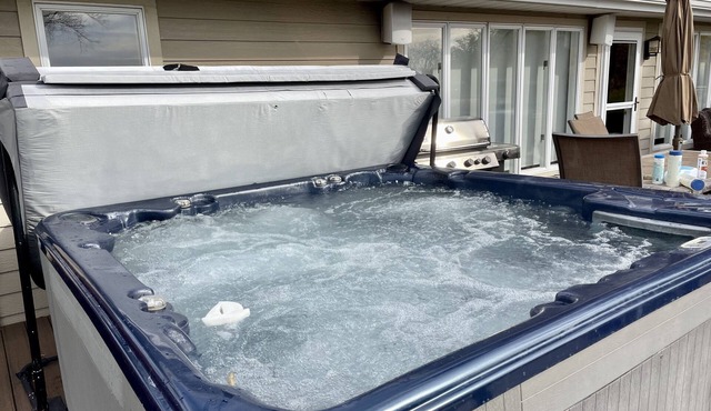 YR ROUND 10 PERSON OUTDOOR HOT TUB! SHUFFLE PUCK, PET FRIENDLY, DESIGNED FOR FUN