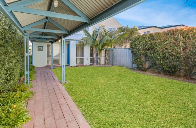 A sunny canal waterfront property with stunning entertaining deck