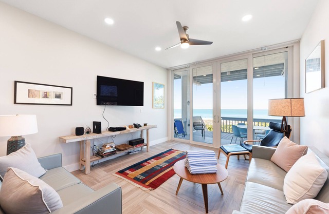 Beachfront condo with WiFi, two decks, Gulf views & pool - walk to the trolley