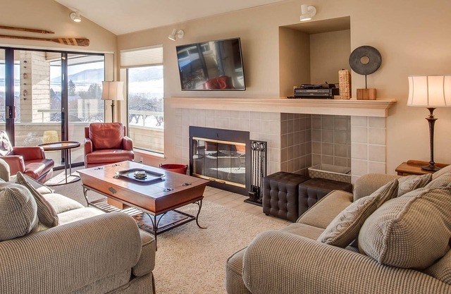 Bright townhouse-style condo with pools, hot tub, & sandy beach access