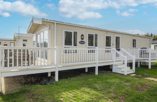Caravan with decking at Broadland Sands in Suffolk ref 20294BS