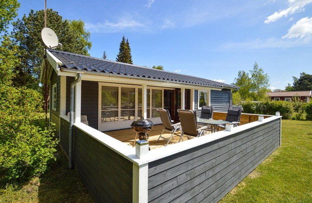 Classic, Danish cottage near the water.