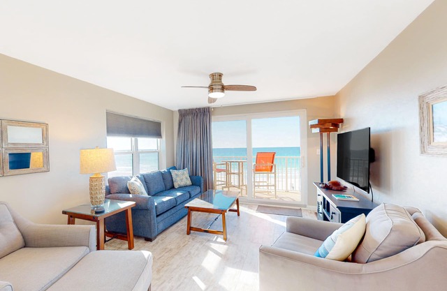 Condo with sweeping panoramic views of the Gulf, two beach chairs & umbrella
