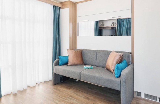 Contemporary mini pod with one double pull-out bed and en suite shower and W.