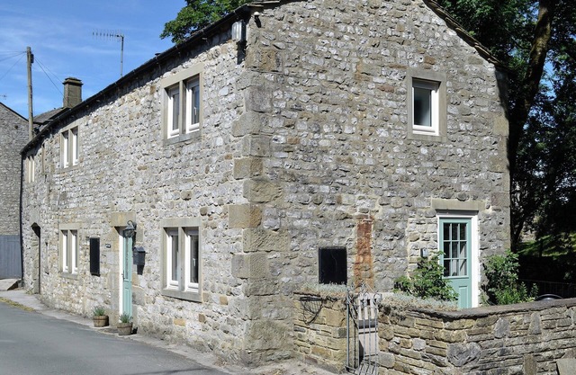 Detached barn conversion with side terrace overlooking the river.