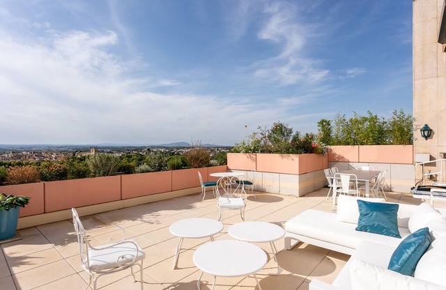 Duplex on the 11th floor: elevator, parking space, air conditioning (AC) and view of Comédie