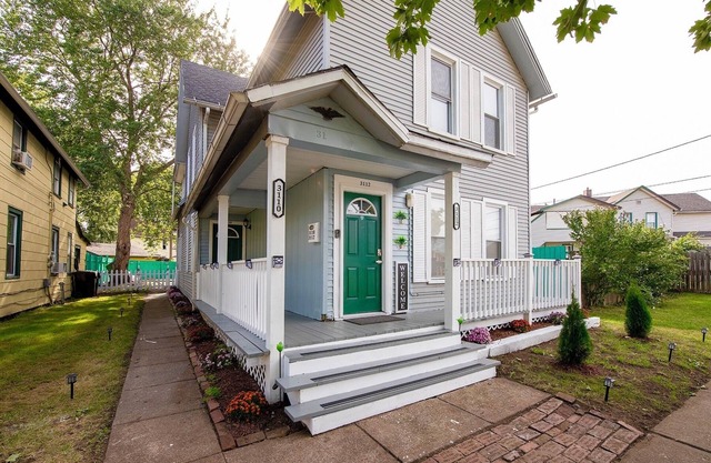 Emerald Oasis: Tremont 4BR Duplex by Christmas Story House | Patio, Laundry, Parking 7 Min Downtown