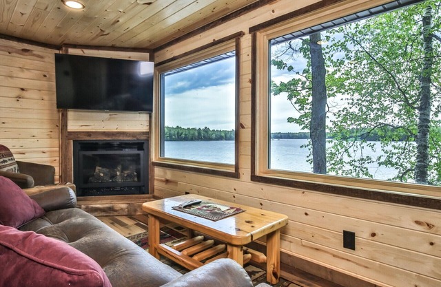 Gorgeous remodeled lakeside cabin with a fireplace, and direct access to the sno