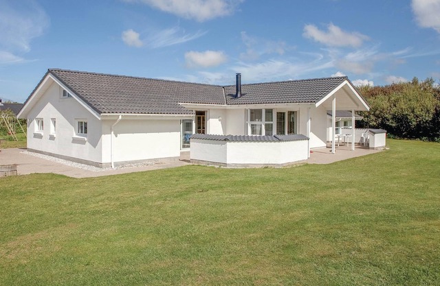 In a quiet vacation area near Lønstrup, this stone vacation home awaits you on a natural plot with p