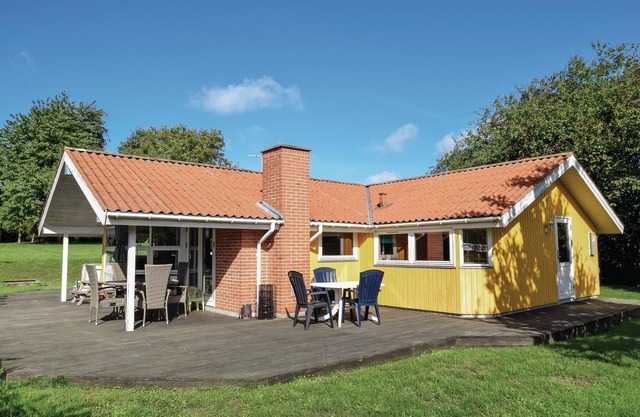 In the midst of beautiful nature on a large plot of land lies this lovely vacation home.