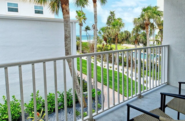 LaPlaya 202E-Catch the gentle Gulf breezes on your private balcony beneath the swaying palms.