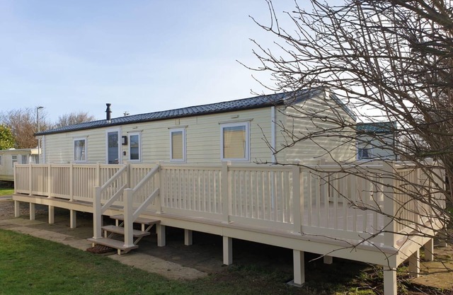 Lovely caravan for hire with decking at Skipsea Sands Holiday Park ref 41161WF