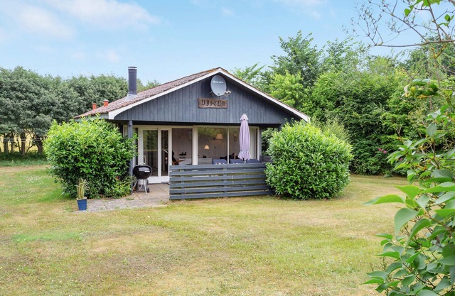 Lovingly furnished cottage on well-kept grounds with lawn and space for ball games.
