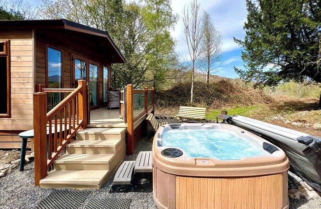 Modern and contemporary lodge style holiday home set in woodland area.