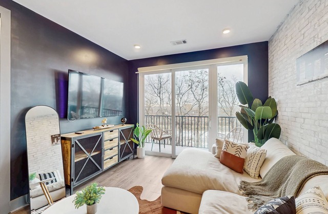 Modern Muse downtown condo with private balcony, central AC, & rooftop lounge