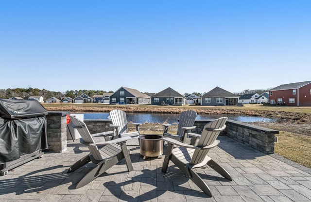 Ocean View Beach Club two-story home with patio, pool, tennis & gym