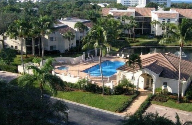 OUTSTANDING LOCATION. End Unit Top Floor Condo near Beach, favored Pelican Bay