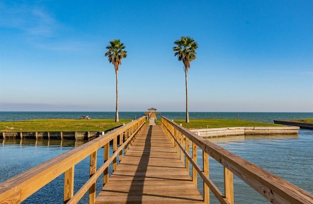 Rockport Racquet and Yacht Club condo with lovely bay views, tree covered grounds, pool, and fishing!