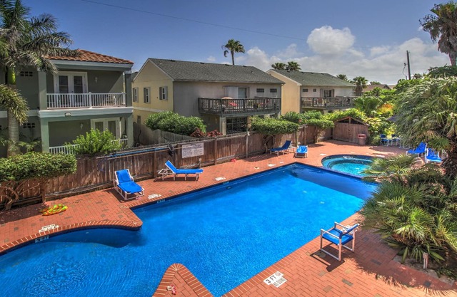 Spacious oasis near the beach with a private balcony, pool, and hot tub