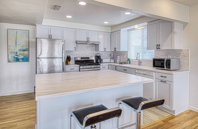 Spacious Upper unit located just two houses from the sand!