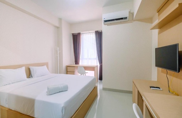 Studio Apartment Grand Taman Melati Margonda 2 near UI By Travelio