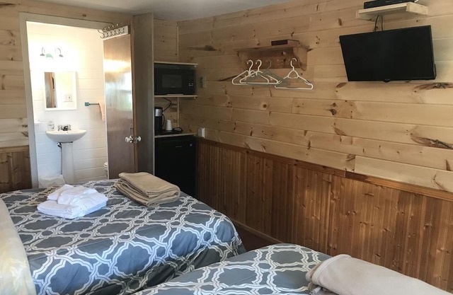 The Coastal Cabins- Cabin # 6 , walking minutes from the sandy beach