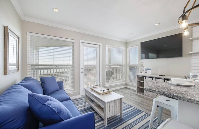 Trendy Beach Condo- Sunset views, Sandy Toes, Surfing more. (1304)