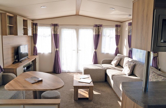 Wheelchair friendly caravan with one double and one twin.