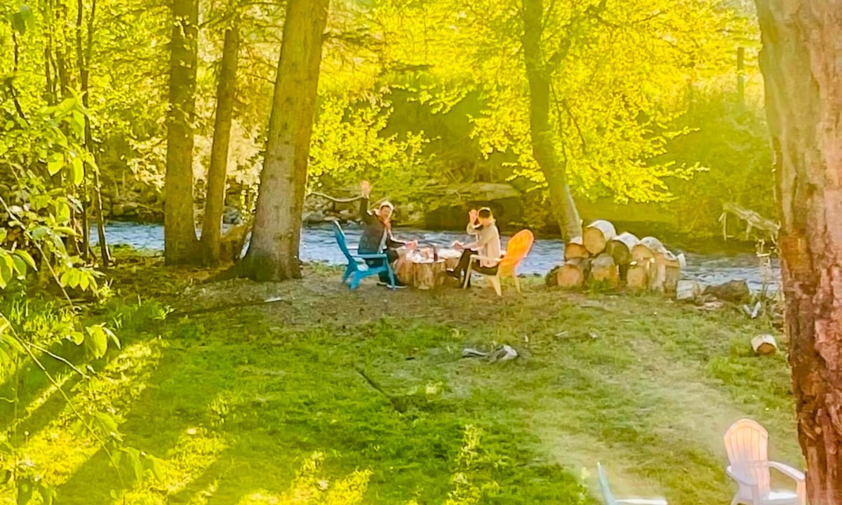 Joseph Cottage | Camp-themed dog-friendly cabin with mountain views, firepit, & river access
