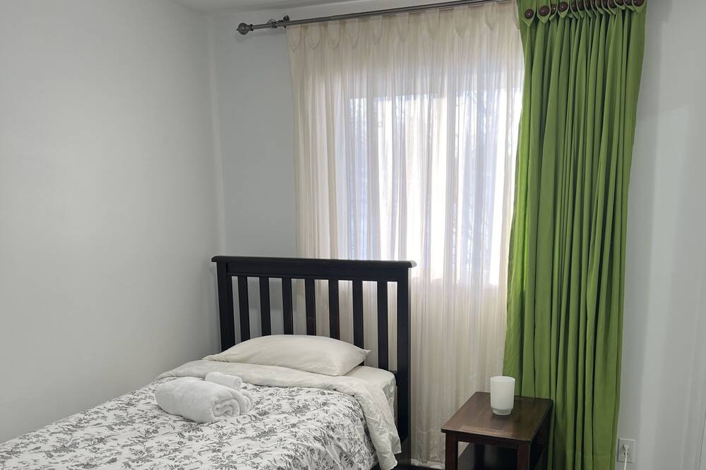 Brandon Apartment | Comfortable Stickney bedroom.