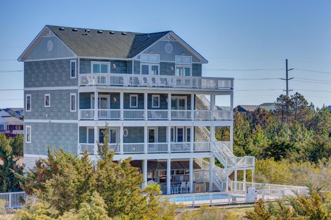 Photo of Buildings in Wind Over Waves