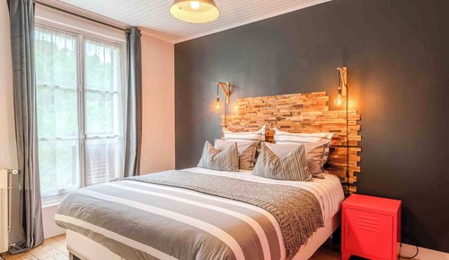 The Atelier/ Superior suite with double to quadruple occupancy featuring a dining area