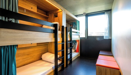 Bed in dormitory of 4 men with private bathroom