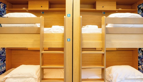 A 4 bed dorm shared bathroom