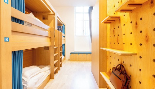 One bed in a 6-bed female dormitory with private bathroom