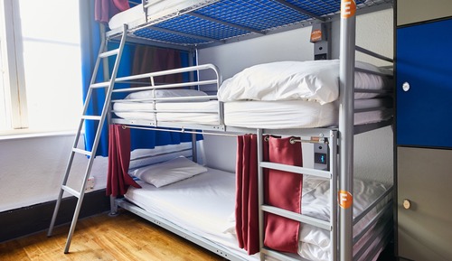 Bed in 9 Bed Dorm with Shared Bathroom (Triple Bunks)