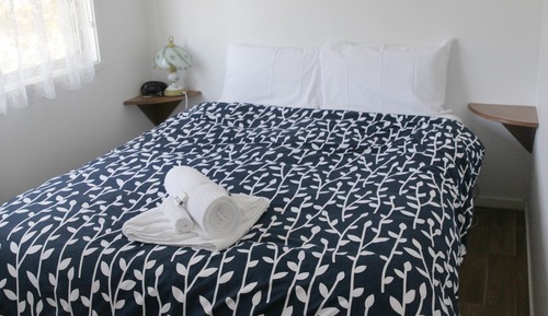 2 bedroom deluxe (1 queen , set of single bunks and a single bed)