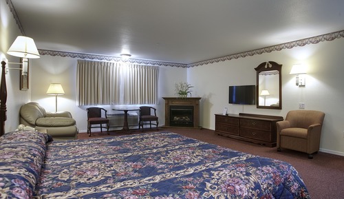 One King Bed with Electric Fire place, Refrigerator & Microwave