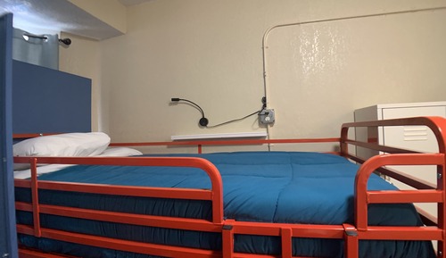 "Single Bed in Female Dormitory Room, Shared Hallway Bathroom