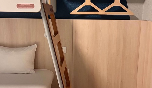Triple Room with a large bed and a bunk bed