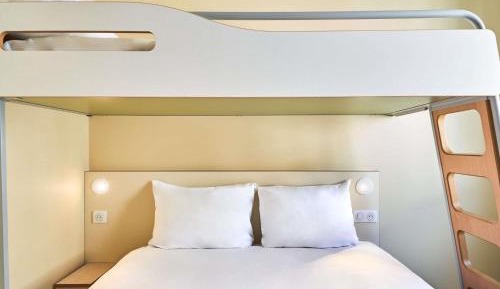 Room with One Queen Bed and One Bunk Bed