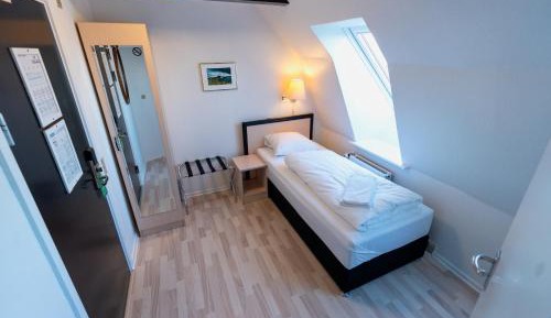 Economy single room, Small bathroom, note stairs to floor