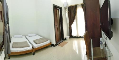 Deluxe Double Room (2 Adults + 1 Child)