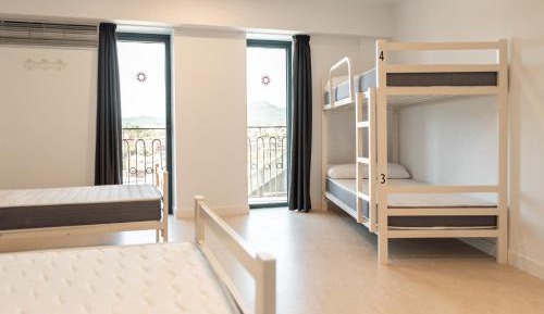 Single Bed in Dormitory Room