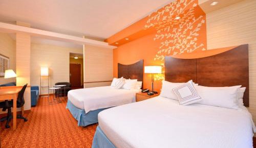 Queen Suite with Two Queen Beds, Sitting Area and Sofa Bed