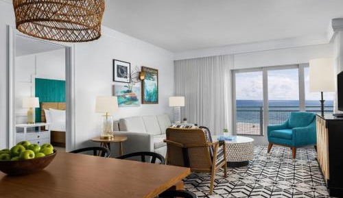 Two-Bedroom Oceanfront Villa with One King Bed, Two Queen Beds, Sofa Bed and Balcony