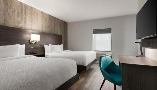 Deluxe Room with Two Queen Beds and Pullout Couch - Non-Smoking