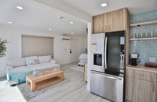 Huntington Harbour Cottage | STEPS TO PRIVATE BEACH FRONT PANORAMIC OCEAN VIEWS! Home - parking lot - sand.