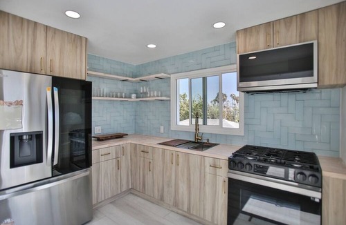 Huntington Harbour Cottage | STEPS TO PRIVATE BEACH FRONT PANORAMIC OCEAN VIEWS! Home - parking lot - sand.